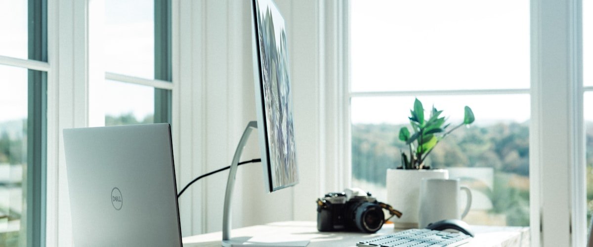 Laptop and streaming device tech setup on a desk